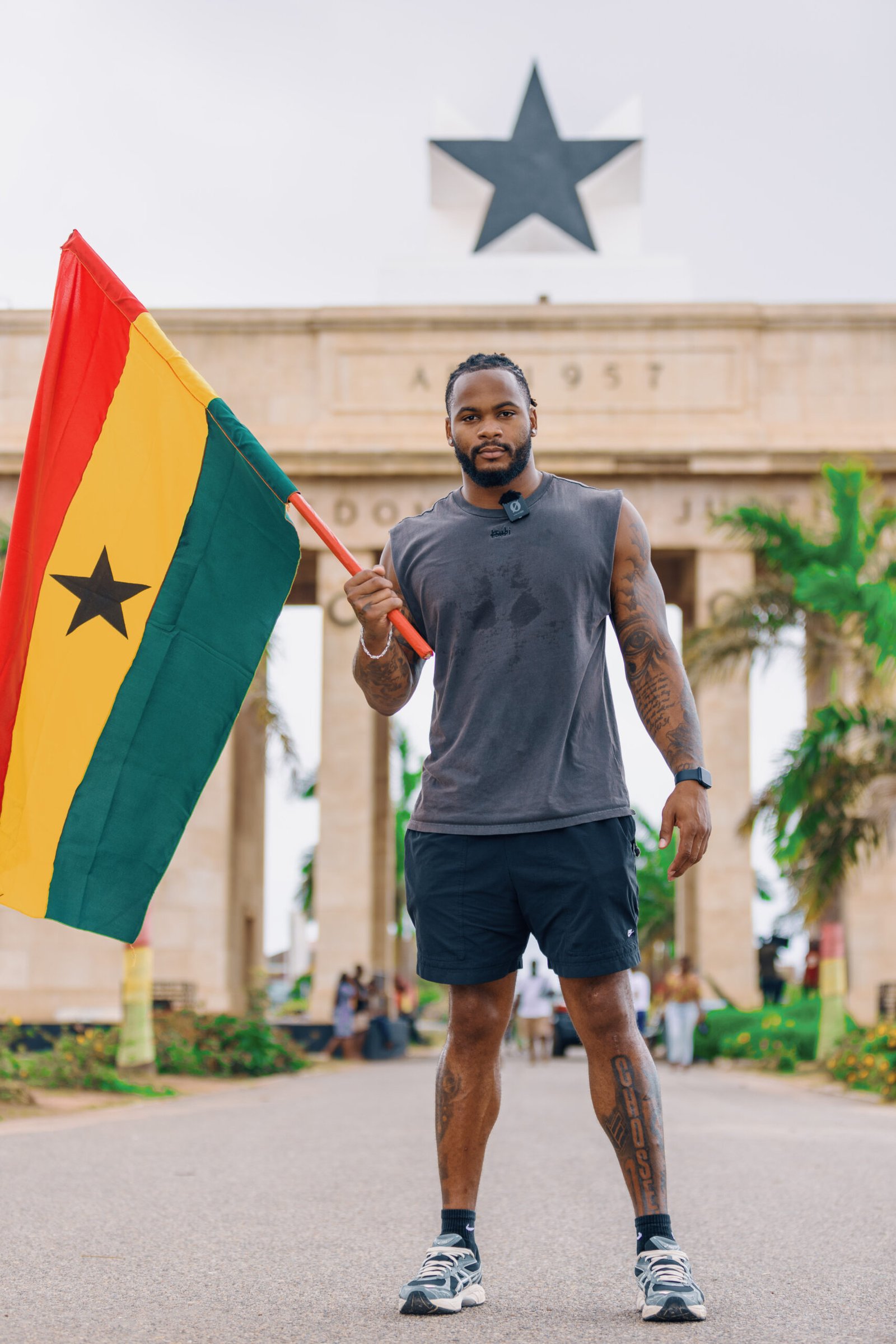 Sam WIlliams with the Ghana flag at the Black Star Square, Accra